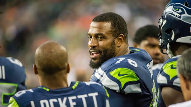 Seattle Seahawks offensive tackle Duane Brown (76) talks to wide receiver Tyler Lockett (16) during the first half against the Denver Broncos at CenturyLink Field.